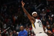 Royce O'Neale of the Utah Jazz celebrates a three-pointer over the Washington Wizards